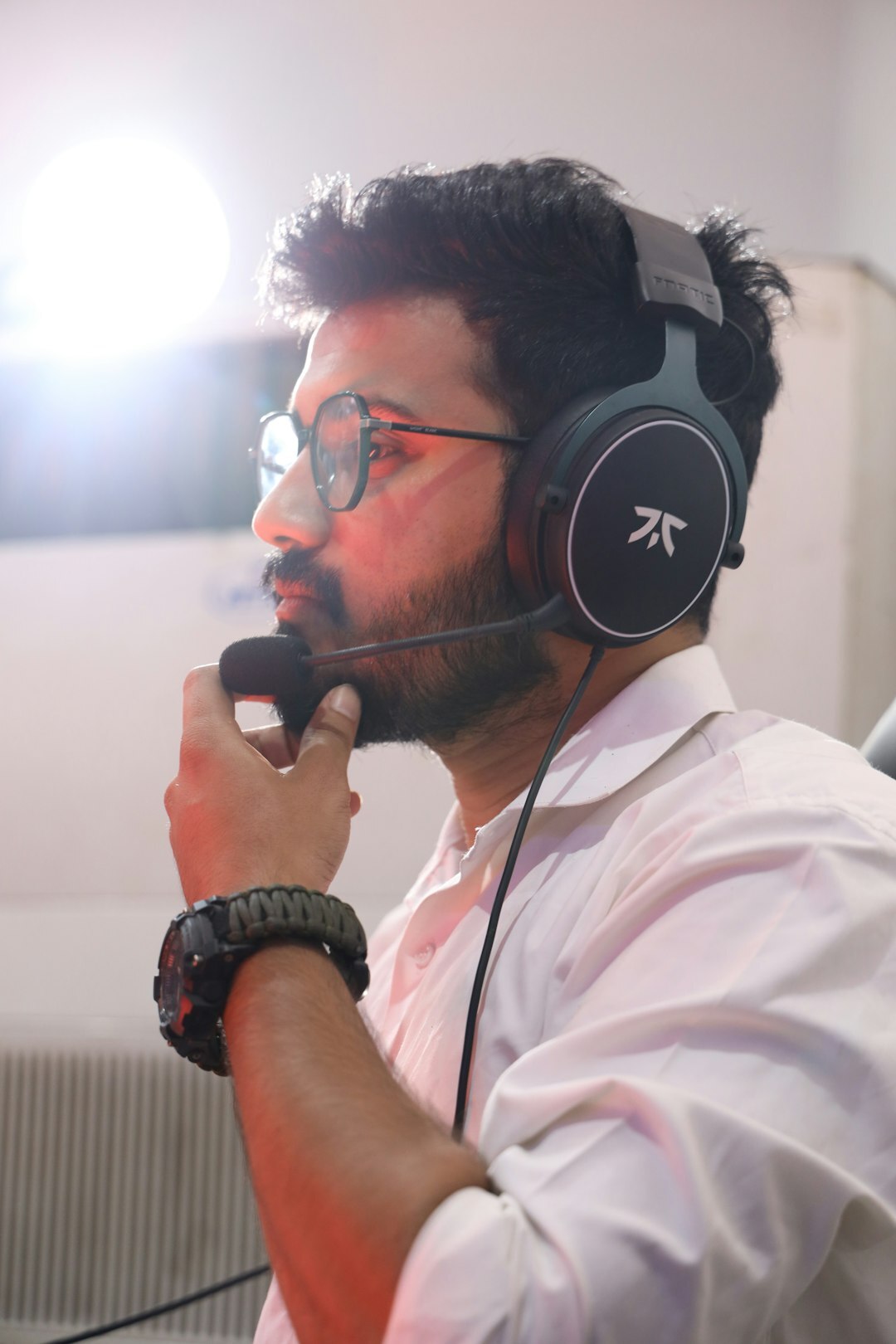 Show producer wearing a headset coordinating a live broadcast