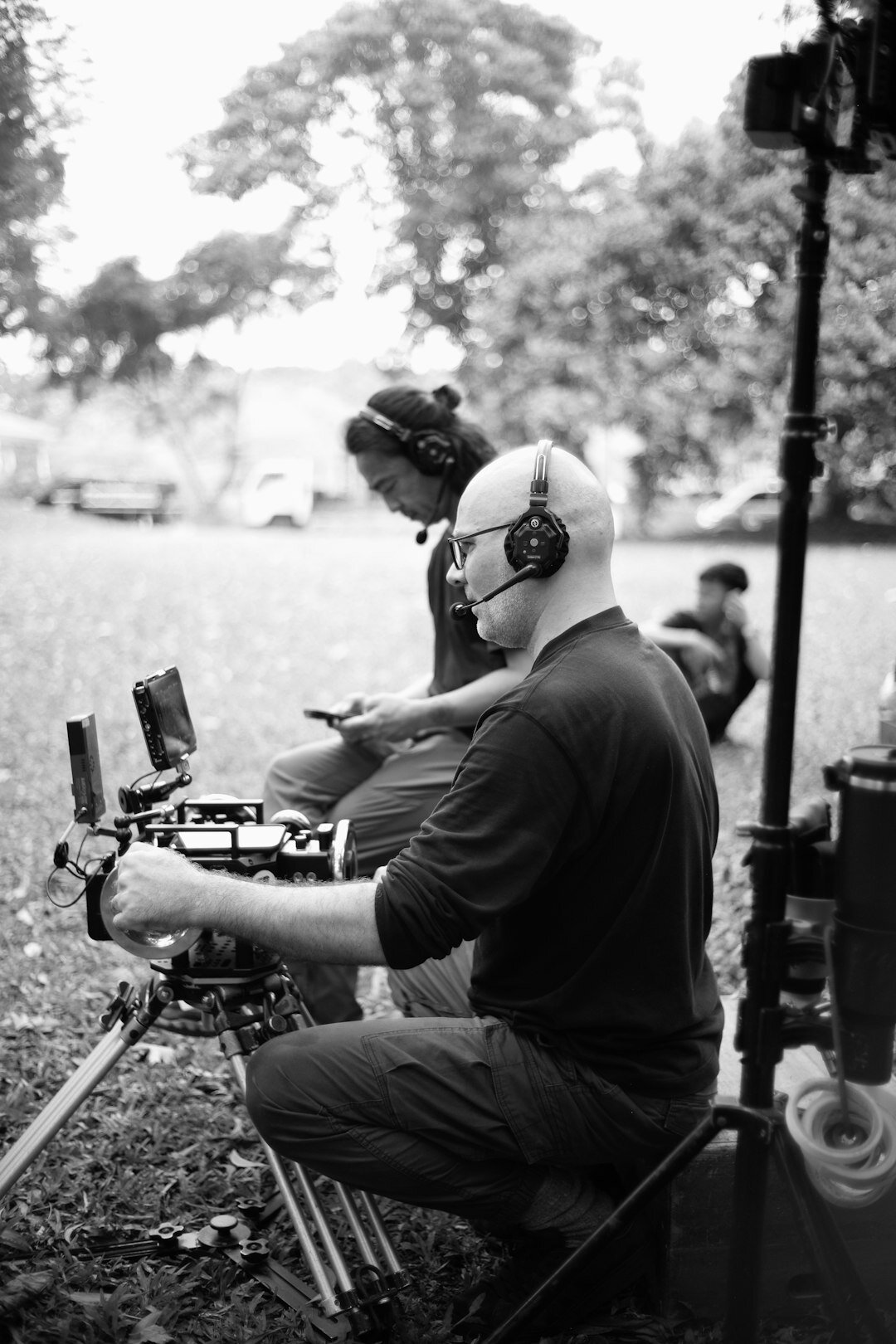 Camera operator filming outdoors during a live sports event